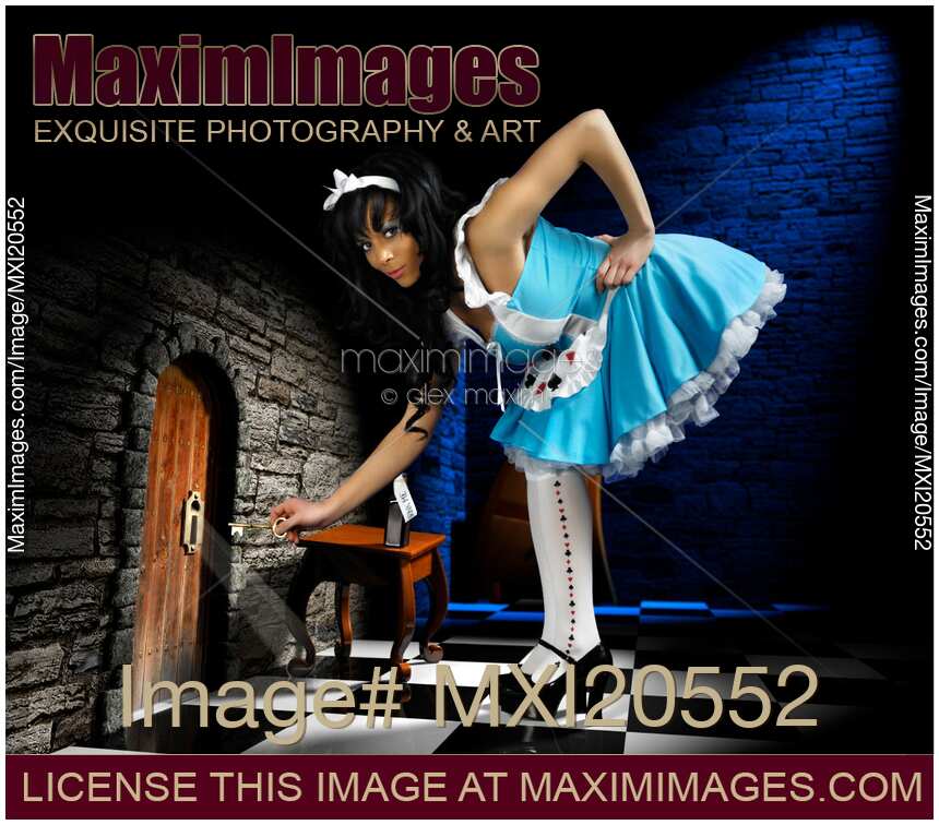 Alice in Wonderland opening a door