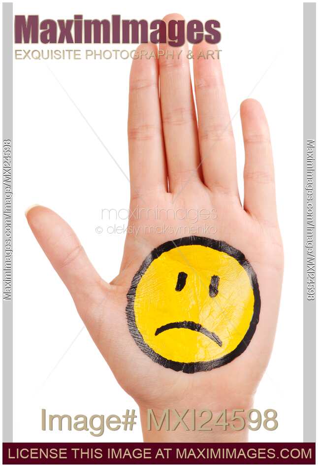 Hand with a sad smiley face icon on it