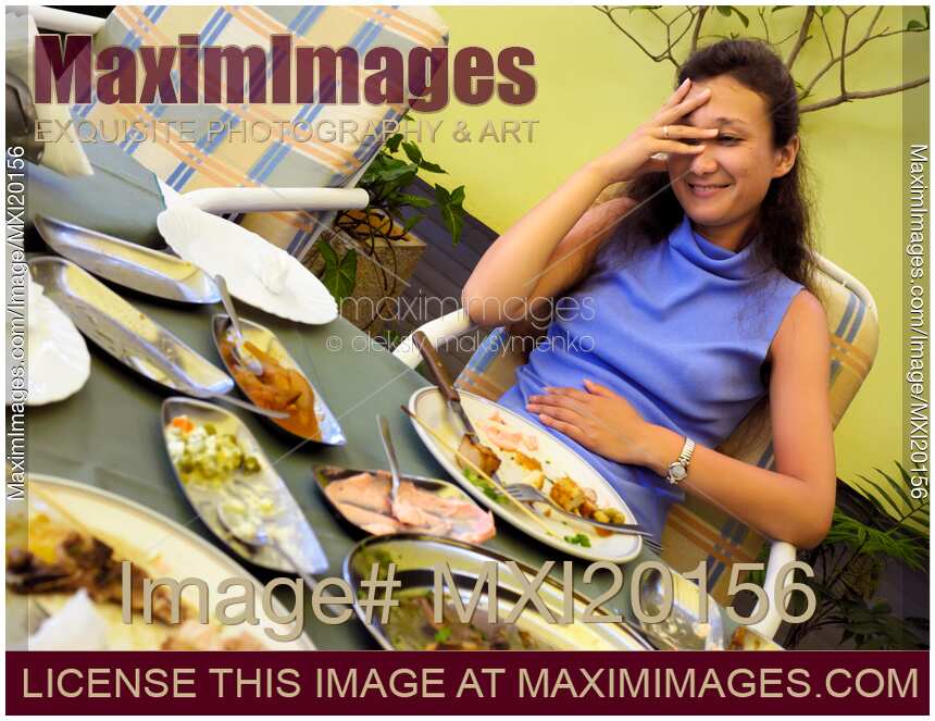 Woman overeaten at a restaurant
