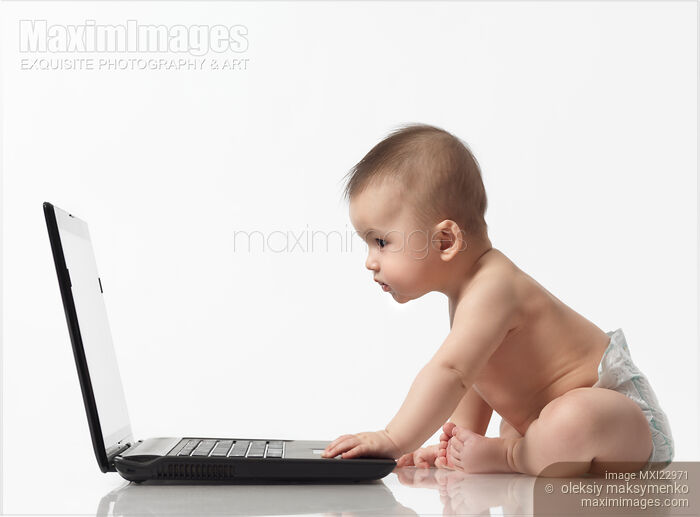 Baby Sitting in Front of a Laptop Stock photo of Baby Sitting in Front of a Laptop Buy commercial use license at MaximImages