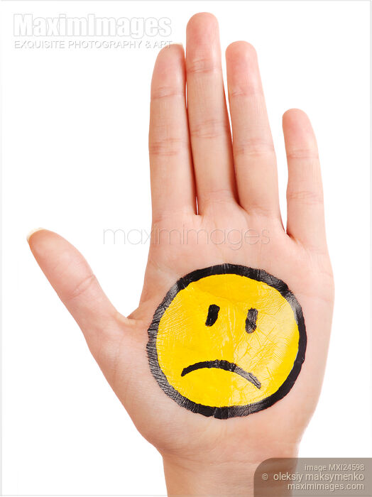 Hand with a sad smiley face icon on it Stock photo of Hand with a sad smiley face icon on it Buy commercial use license at MaximImages