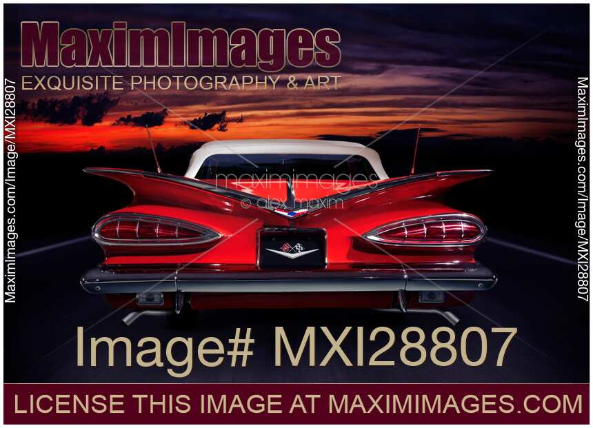 1959 Chevrolet Impala Convertible on road in sunset