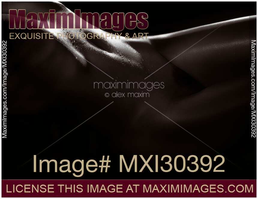 Abstract art nude black and white of a woman body sexy curves outlined by dim contrast light