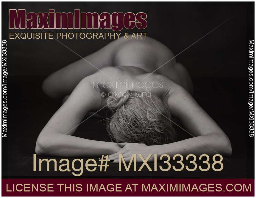 Abstract fine art nude bodyscape a woman lying on a studio floor