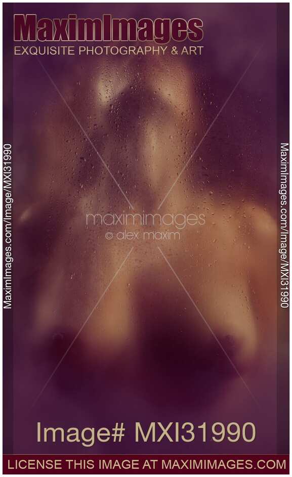 Abstract nude sexy woman with ecstatic moaning expression behind a wet hazy glass in dark