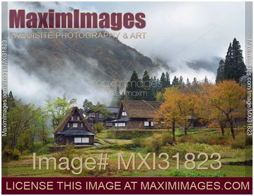 Ainokura mountain village with traditional Japanese Gassho-style houses in a foggy autumn morning country scenery