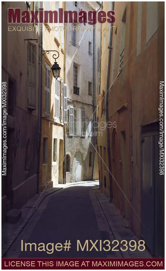 Aix-en-Provence narrow empty street with old crooked stone houses Provence South of France