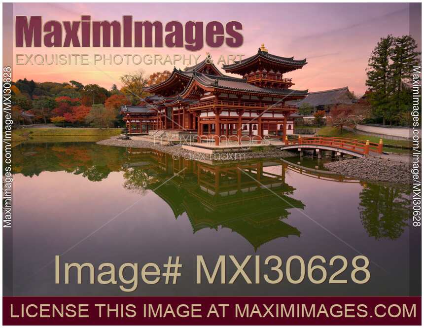 Amida hall of Byodo-in Buddhist temple amidst Jodoshiki teien garden pond sunrise scenery Uji Japan
