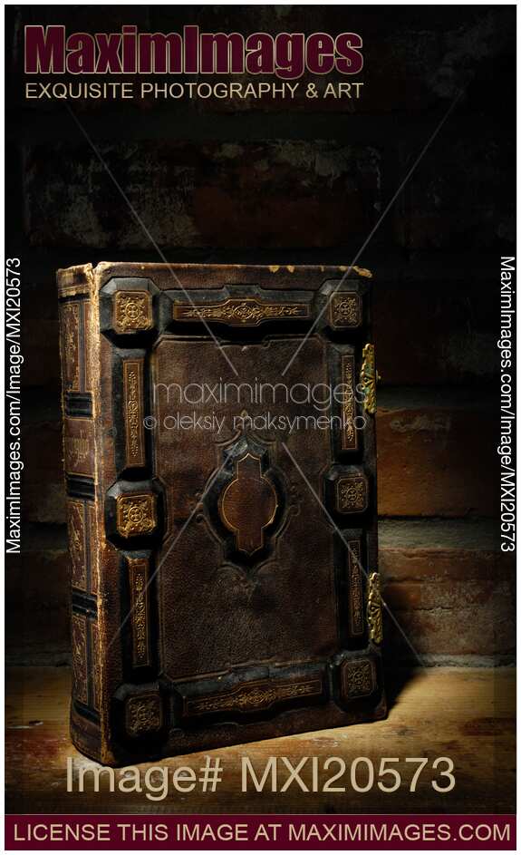 Ancient Book Illuminated in Darkness