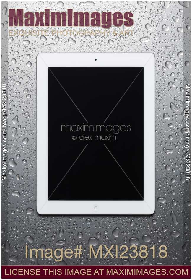 Apple iPad 2 Tablet Computer on Metal Background