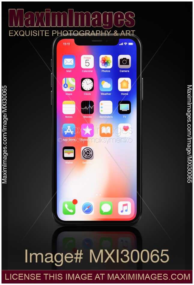 Apple iPhone X smartphone with colorful desktop on display isolated on black background