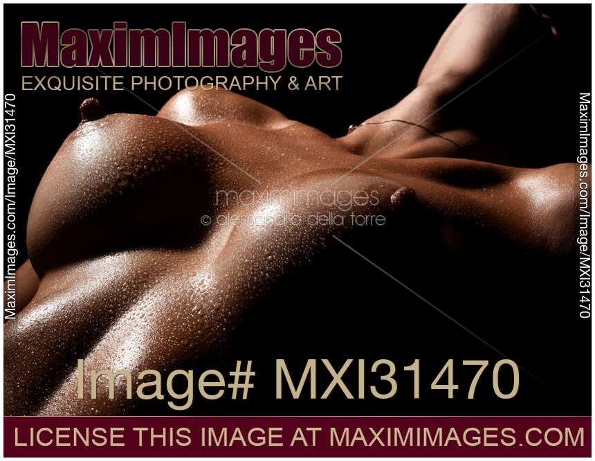 Art nude closeup of a woman naked breast with wet skin