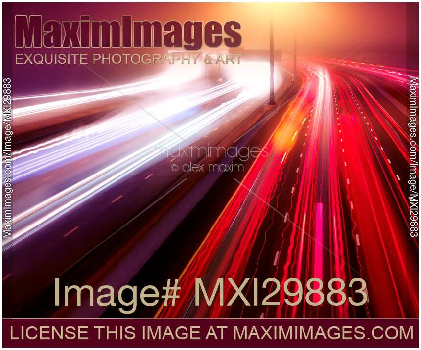 Artistic abstract highway traffic light trails in fog at nighttime