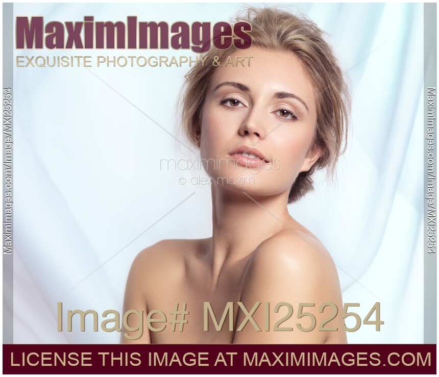 Artistic beauty portrait  of woman on flowy fabric background