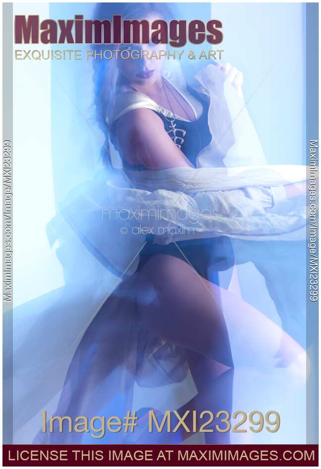 Artistic fashion photo of Woman Dancing in Light