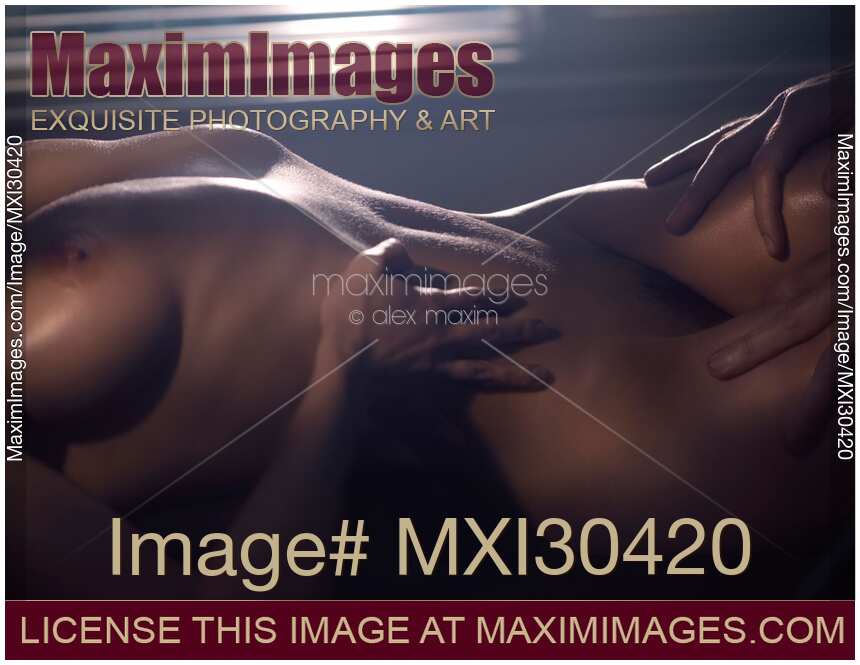 Artistic nude sexy couple body parts man hands and naked woman body in dim night light