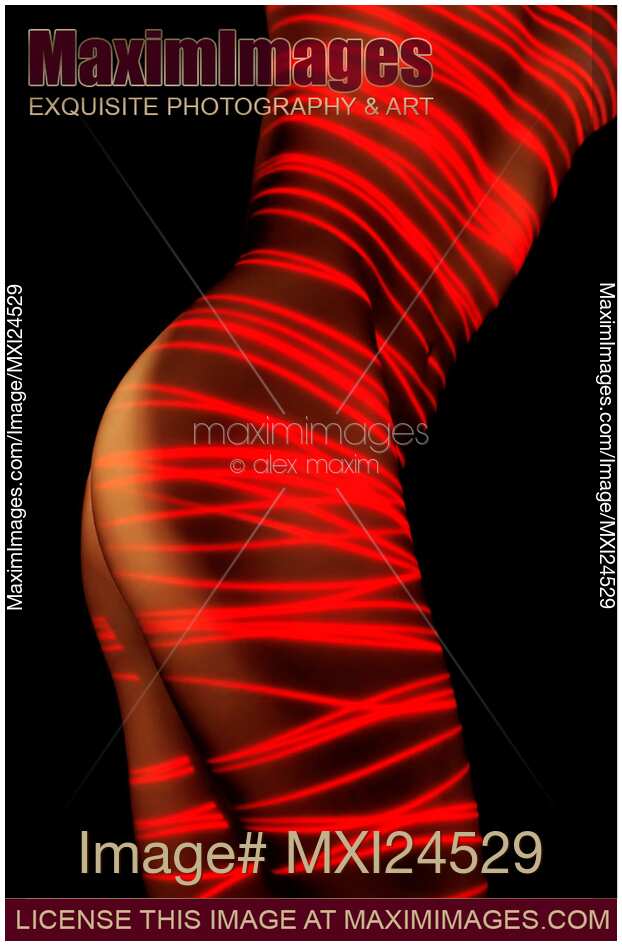 Artistic nude woman body painted with red laser