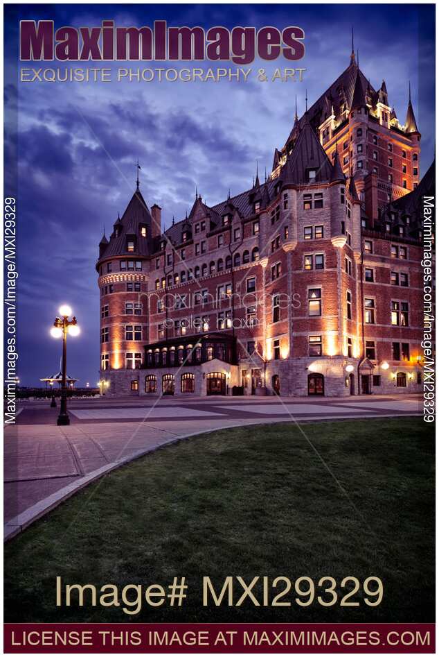 Artistic photo of Fairmont Le Château Frontenac lit by streetlights at night in Old Quebec City