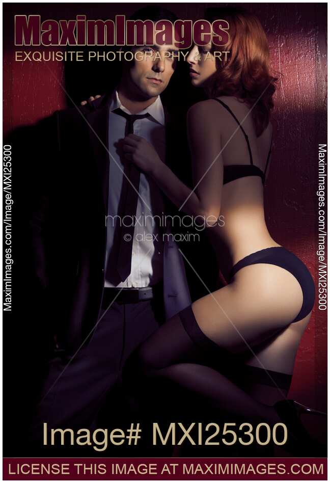 Artistic photo of sexy young couple in dramatic light