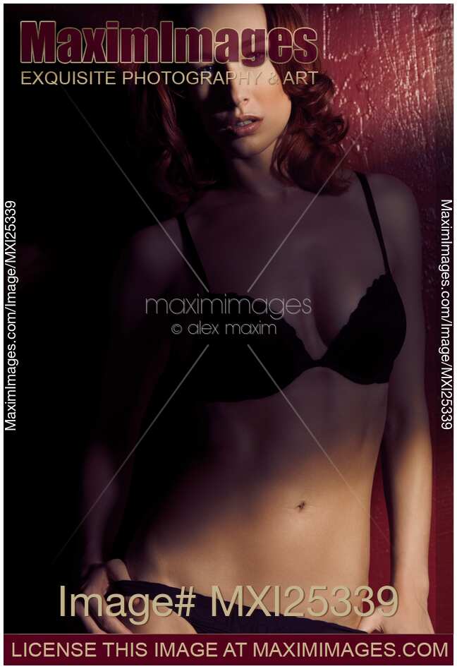 Artistic portrait of sexy redhead woman in lingerie