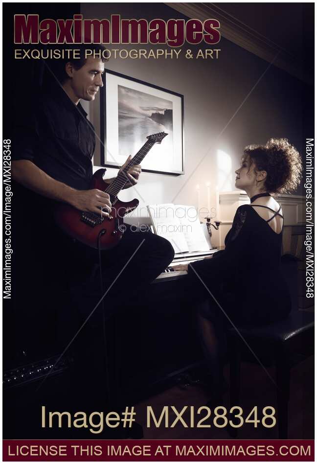 Artistic portrait of Young couple playing music