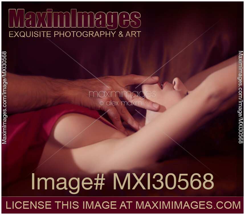 Artistic sensual couple closeup man hand touching woman lips