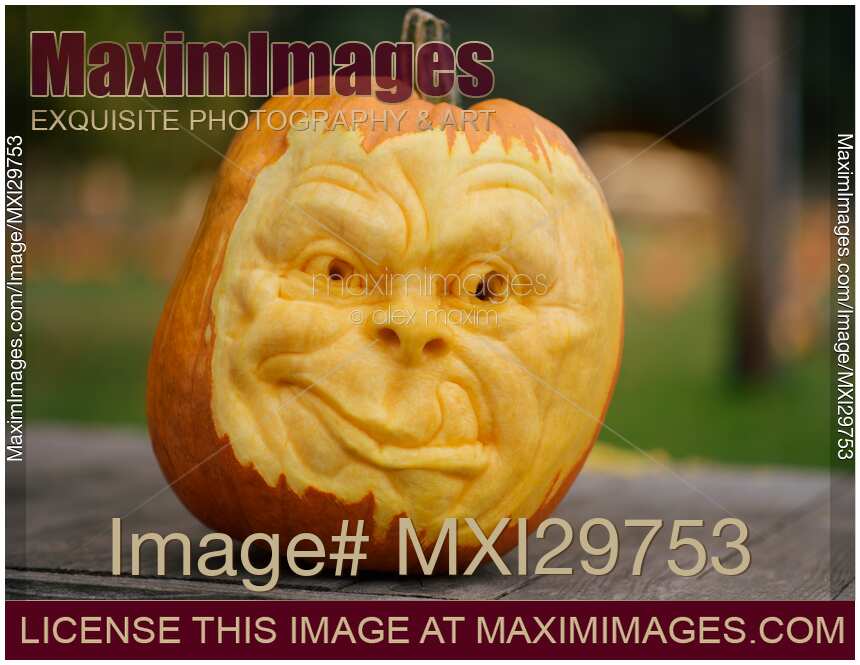 Artistically carved face in a pumpkin for Halloween decoration