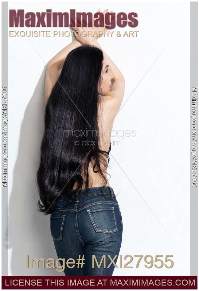 Asian woman in jeans with long beautiful hair