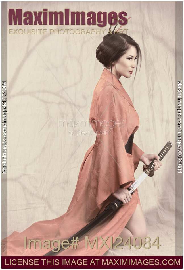 Asian woman in red kimono with a sword