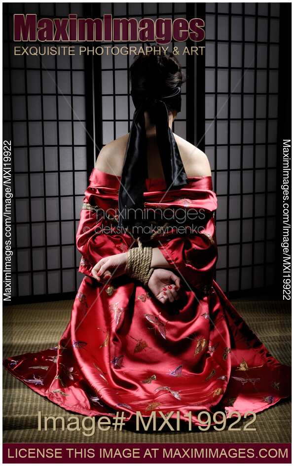 Asian Woman with Her Hands Tied Behind Her Back