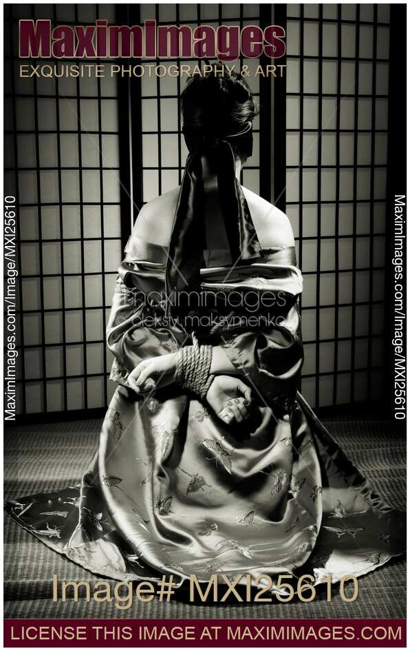 Asian Woman with Her Hands Tied Behind Her Back