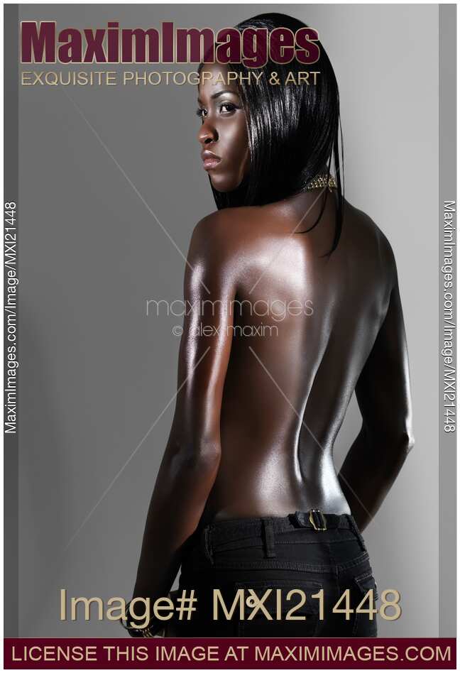 Attractive Woman Standing with Her Back to the Camera