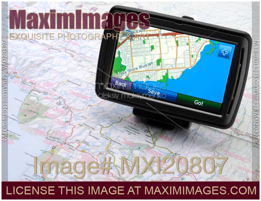 Stock photo Automotive GPS on a road map MaximImages