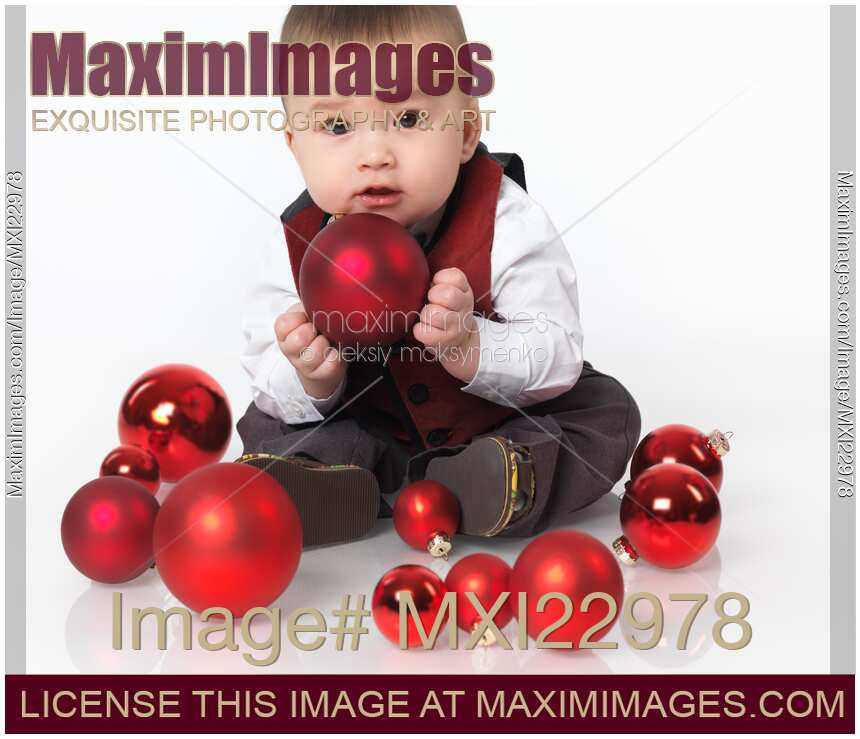 Baby Boy Playing with Christmas Baubles