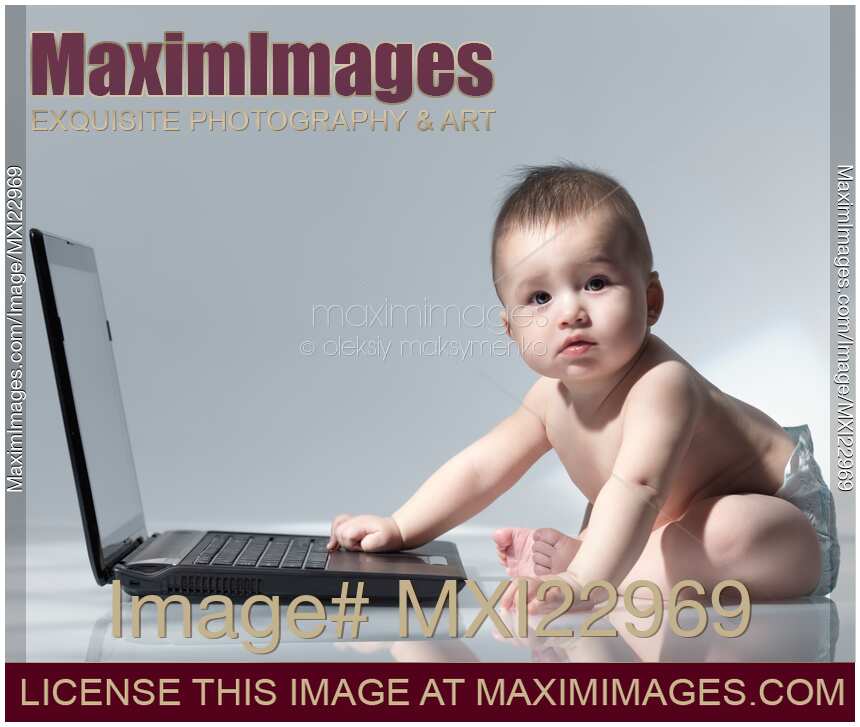 Baby Sitting in Front of a Laptop