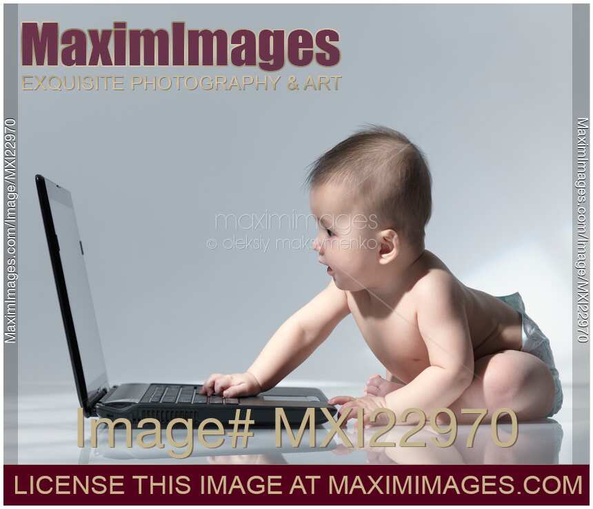 Baby Sitting in Front of a Laptop