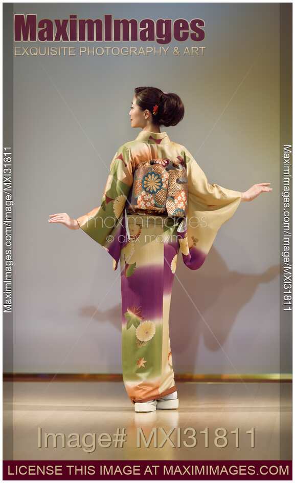 Back of a woman in beautiful kimono at a fashion show in Japan