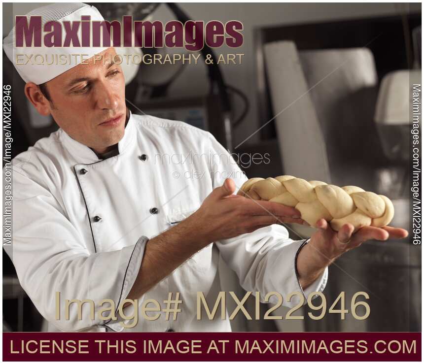 Baker Holding Raw Bread