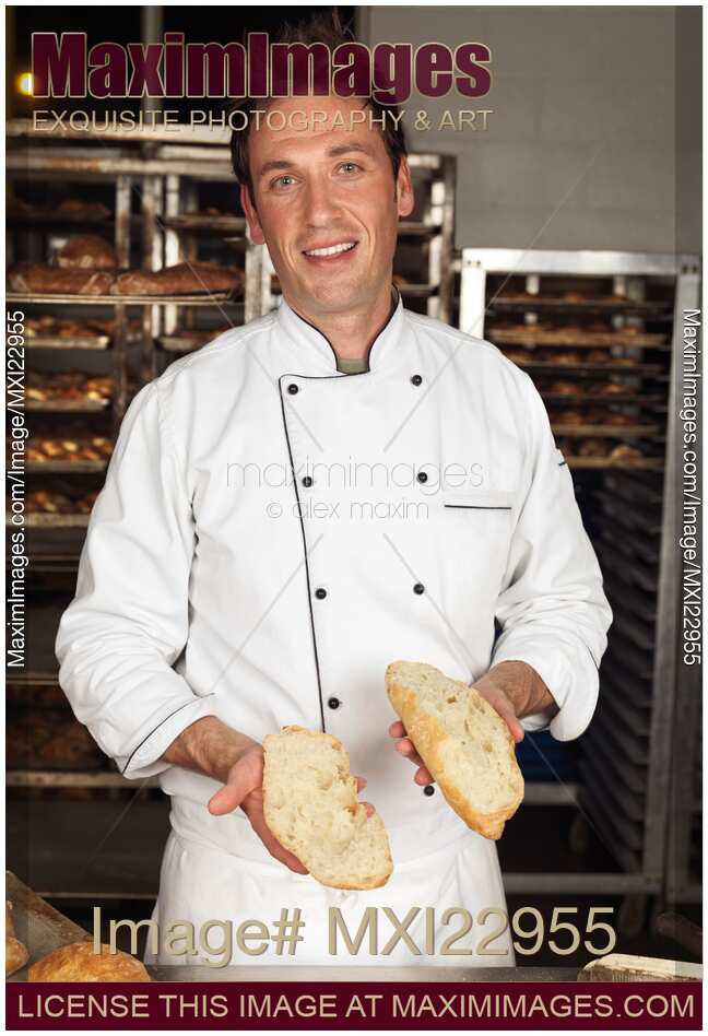 Baker with a Freshly Baked Bread in His Hands