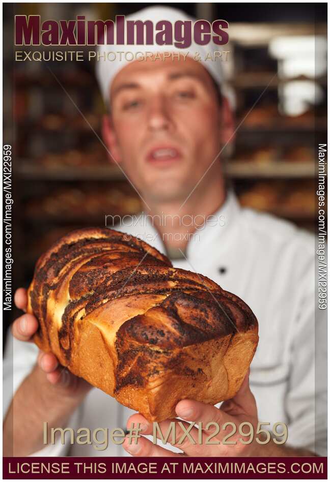 Baker with a Freshly Baked Bread in His Hands