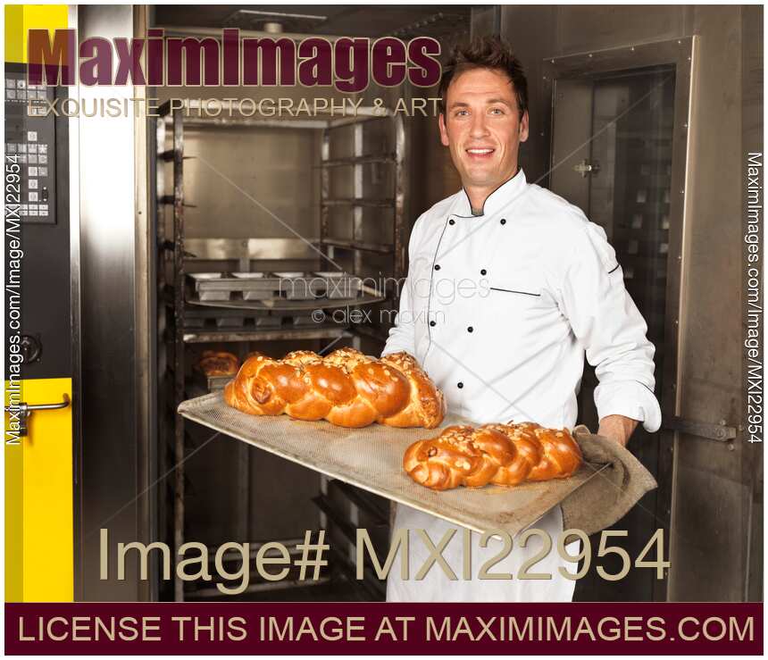 Baker with a Freshly Baked Breads on a Tray