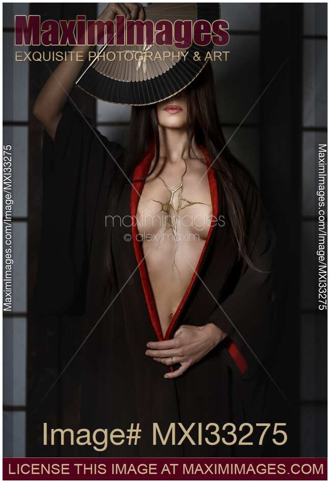 Beautiful asian woman in black kimono with gold filled crack in her open chest over her broken heart. Kintsugi Japanese Zen wabi-sabi concept.