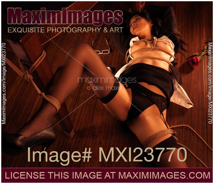 Beautiful Asian Woman Tied Up with Ropes on the Floor