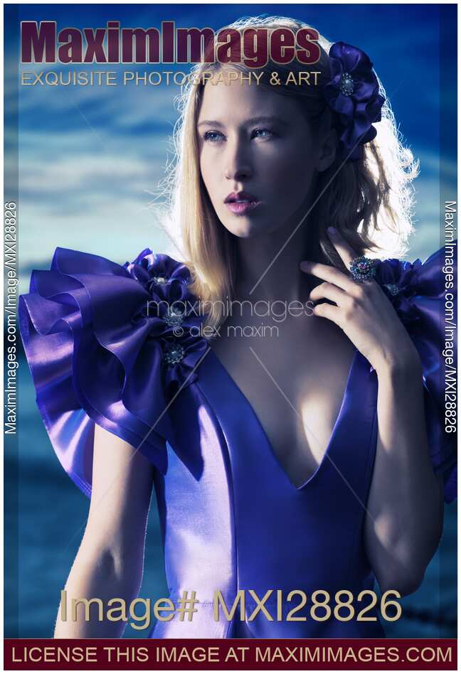 Beautiful blond woman in blue dress beauty portrait