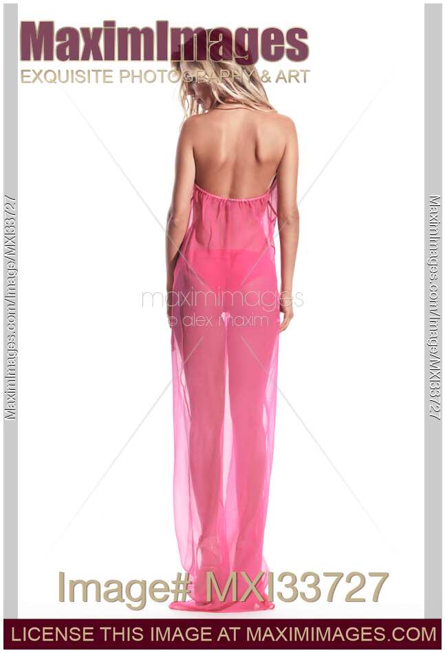 Beautiful blond young woman wearing pink beachwear beach cover revealing her back