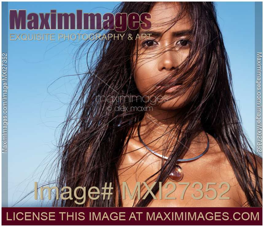 Beautiful exotic asian woman face with long wet dark hair