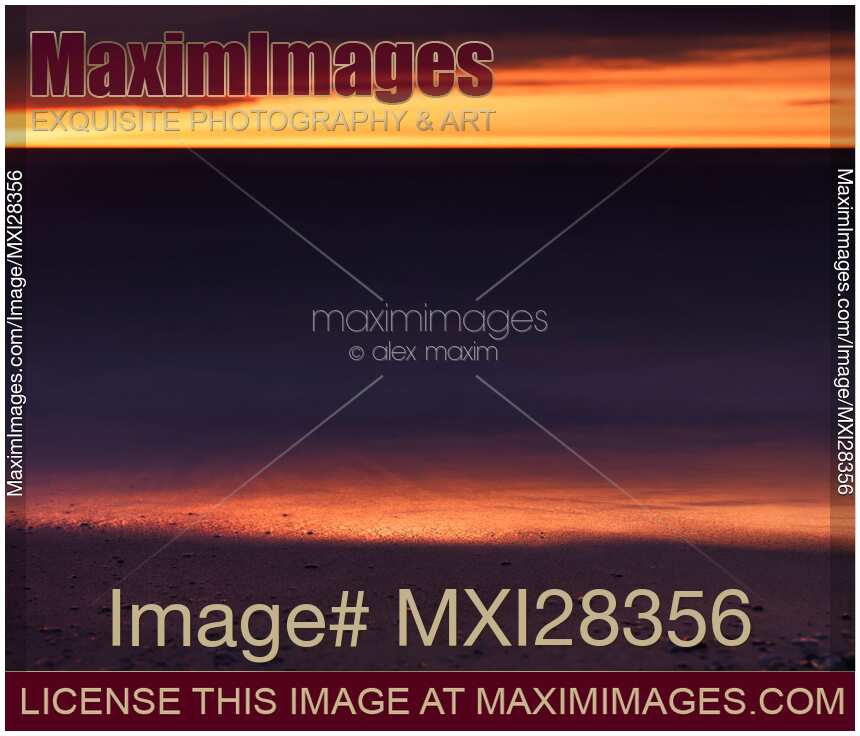 Beautiful golden sunset reflecing in the shore line of lake Huron
