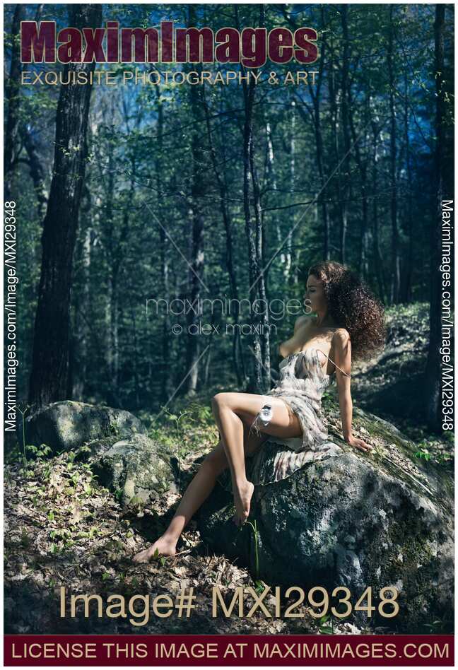 Beautiful half naked sexy young woman in a forest sensual artistic portrait