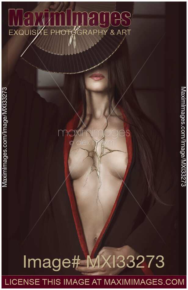 Beautiful Japanese woman in black kimono open on her chest showing cracks of broken heart filled with gold. Wabi-sabi Kintsugi concept.