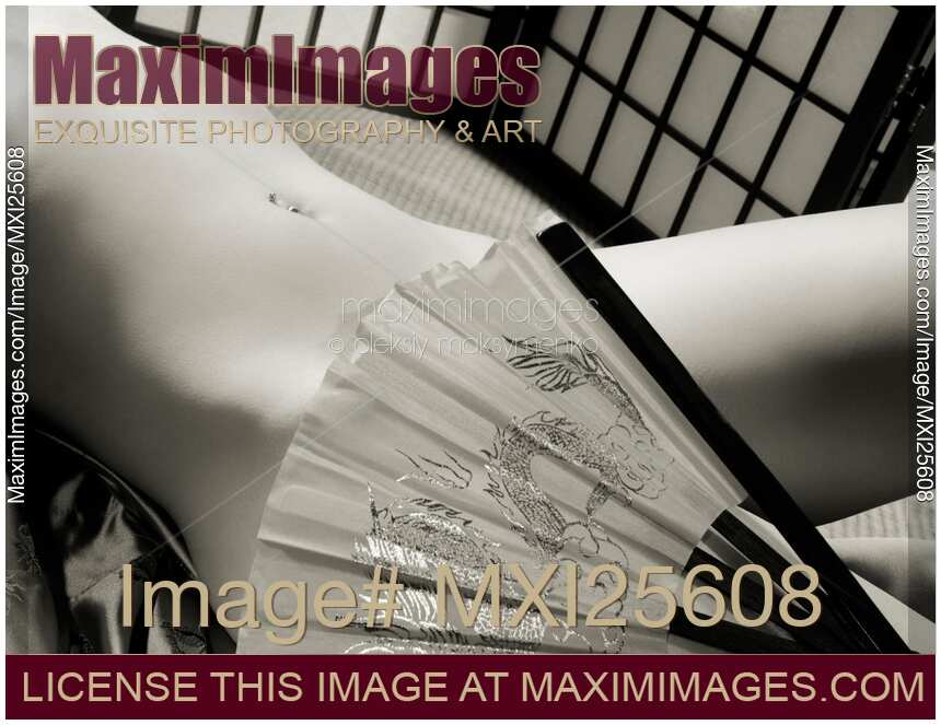 Beautiful Naked Asian Woman Body with a Hand Fan